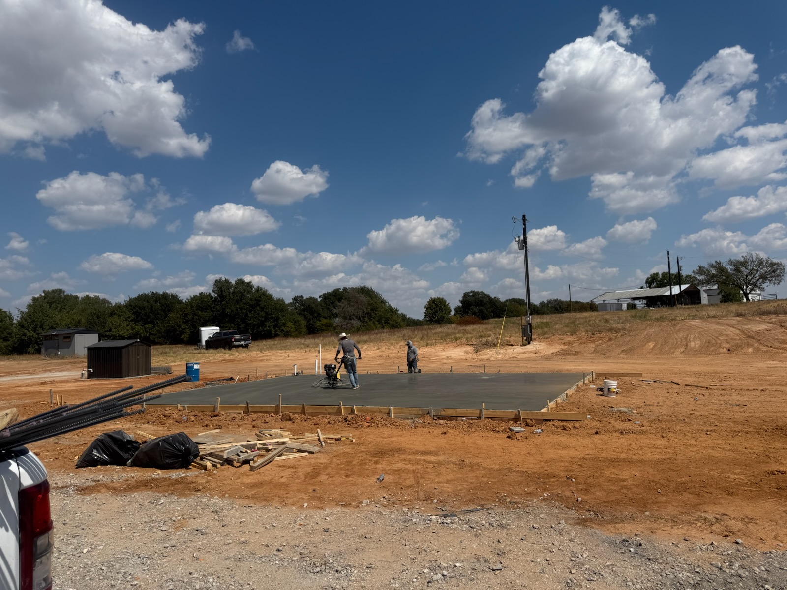 Junior Concrete crew finishing a foundation slab